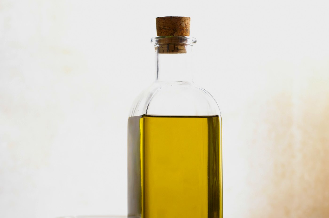 Glass bottle of golden cooking oil